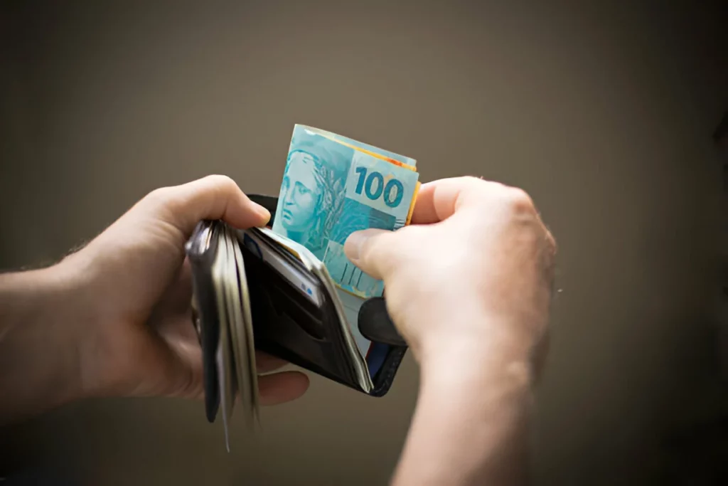 Hands catching money from the wallet
